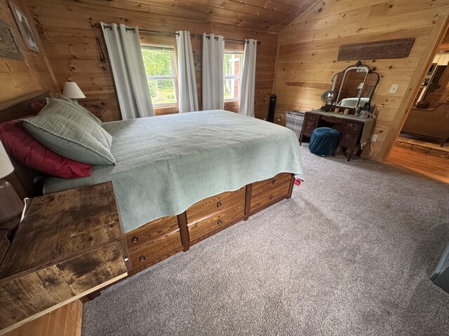71 Garland Rd, Dixmont, ME 04932 - bedroom featuring wood walls, carpet flooring, and lofted ceiling