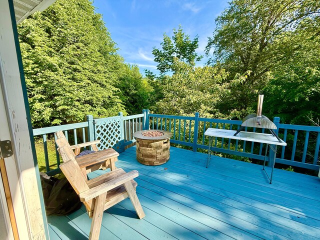 520 W Shore Rd, Sorrento, ME 04677 - wooden deck with an outdoor fire pit