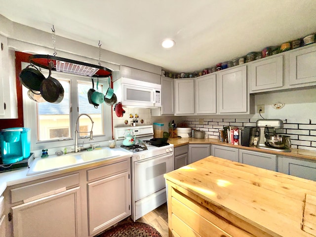 520 W Shore Rd, Sorrento, ME 04677 - kitchen featuring white appliances, tasteful backsplash, and butcher block countertops