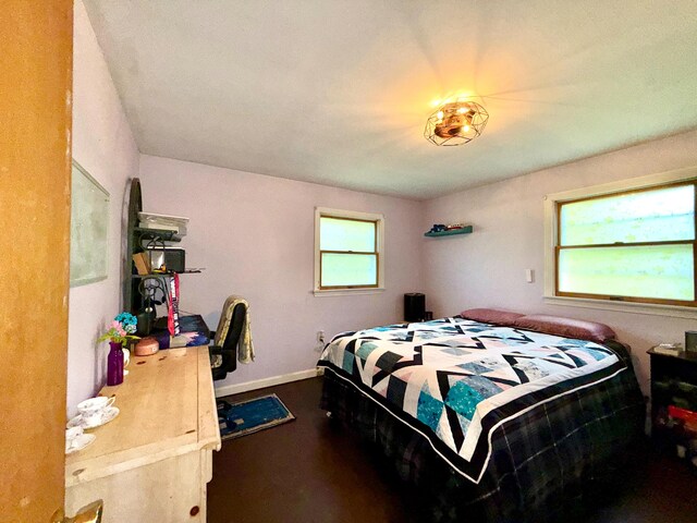 520 W Shore Rd, Sorrento, ME 04677 - bedroom with dark wood-style flooring and baseboards