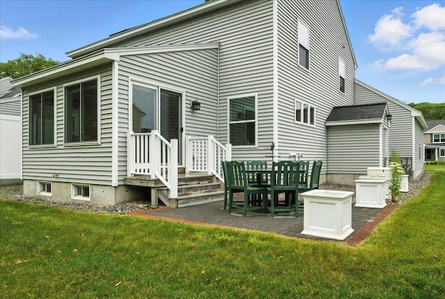 17 Beryl Loop Unit F65, Topsham, ME 04086 - rear view of house featuring a lawn and a patio