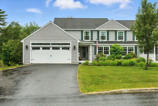 17 Beryl Loop Unit F65, Topsham, ME 04086 - view of front of home with driveway, an attached garage, and a front yard