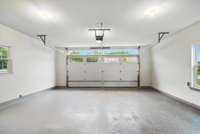 17 Beryl Loop Unit F65, Topsham, ME 04086 - garage with a garage door opener and baseboards
