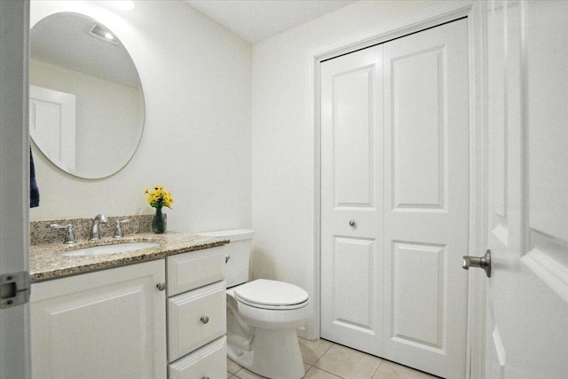 17 Beryl Loop Unit F65, Topsham, ME 04086 - bathroom featuring vanity, tile patterned floors, and a closet