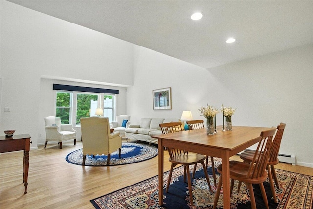 17 Beryl Loop Unit F65, Topsham, ME 04086 - dining space with light wood-style floors, recessed lighting, a baseboard radiator, and lofted ceiling
