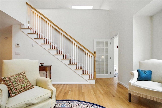 17 Beryl Loop Unit F65, Topsham, ME 04086 - staircase with wood finished floors and a towering ceiling