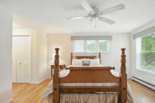 17 Beryl Loop Unit F65, Topsham, ME 04086 - bedroom with light wood finished floors, baseboard heating, and ceiling fan