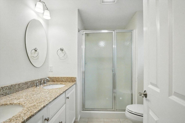 17 Beryl Loop Unit F65, Topsham, ME 04086 - bathroom with double vanity, a stall shower, and tile patterned floors