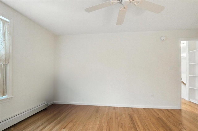 17 Beryl Loop Unit F65, Topsham, ME 04086 - unfurnished room with a baseboard heating unit, light wood-style flooring, and ceiling fan