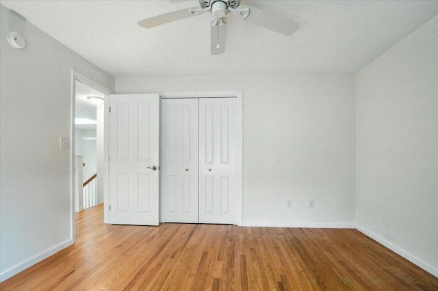 17 Beryl Loop Unit F65, Topsham, ME 04086 - unfurnished bedroom featuring light wood-style floors, a closet, and a ceiling fan