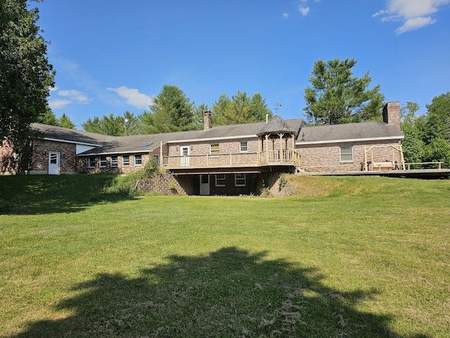 94 Blaisdell Rd, Newport, ME 04953 - back of house with a chimney, a lawn, and a wooden deck