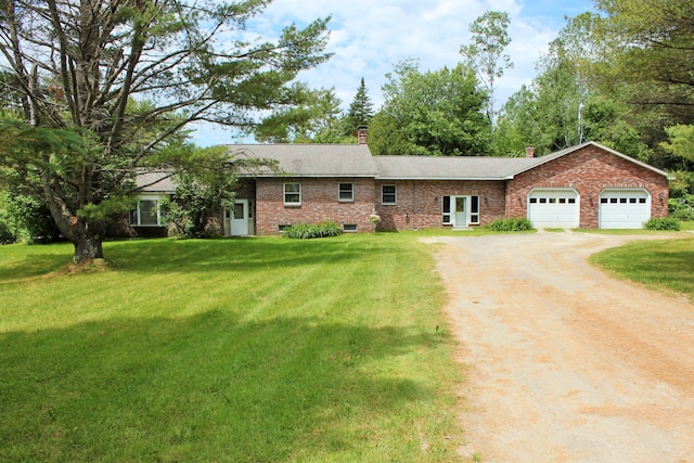 94 Blaisdell Rd, Newport, ME 04953 - single story home with driveway, a chimney, brick siding, and a front lawn