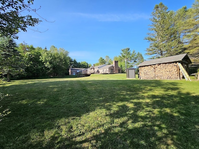 94 Blaisdell Rd, Newport, ME 04953 - view of green lawn featuring a shed