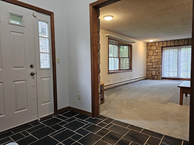 94 Blaisdell Rd, Newport, ME 04953 - entryway featuring baseboard heating, dark colored carpet, a textured ceiling, and healthy amount of natural light