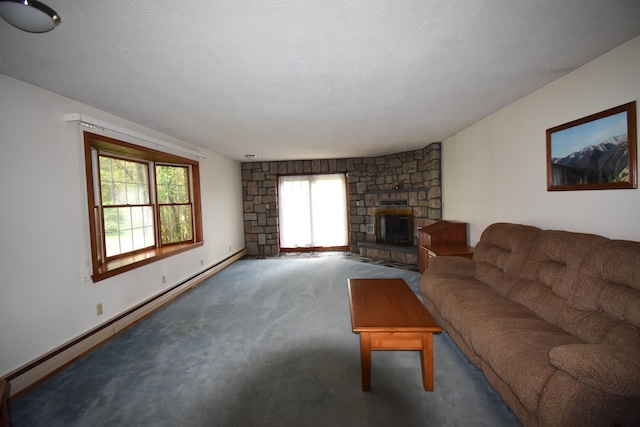 94 Blaisdell Rd, Newport, ME 04953 - carpeted living room with baseboard heating, plenty of natural light, and a stone fireplace