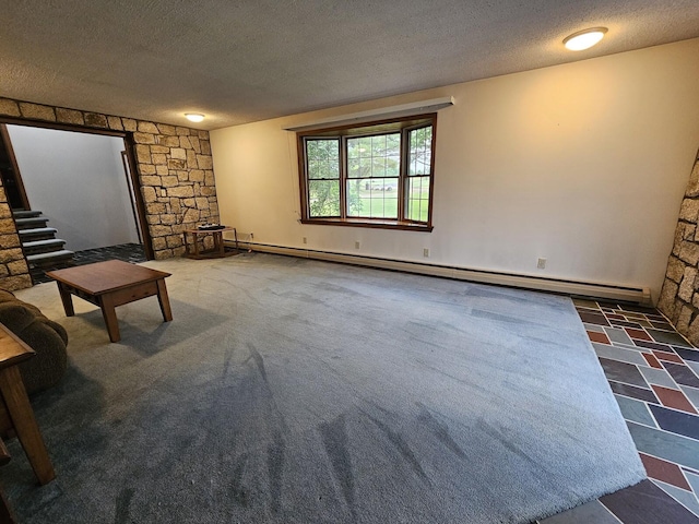 94 Blaisdell Rd, Newport, ME 04953 - unfurnished living room with baseboard heating and a textured ceiling