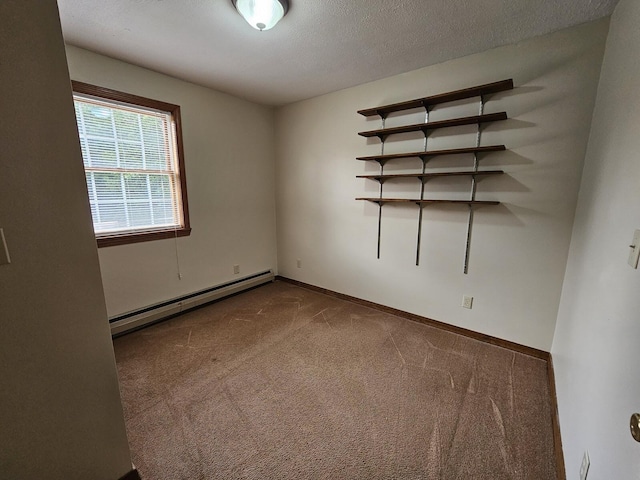 94 Blaisdell Rd, Newport, ME 04953 - carpeted empty room with baseboard heating and a textured ceiling