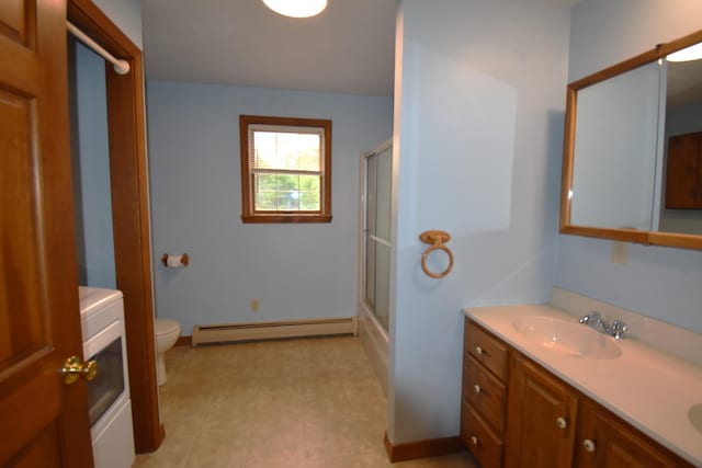 94 Blaisdell Rd, Newport, ME 04953 - full bathroom featuring a baseboard radiator, a shower with door, double vanity, and washer / clothes dryer