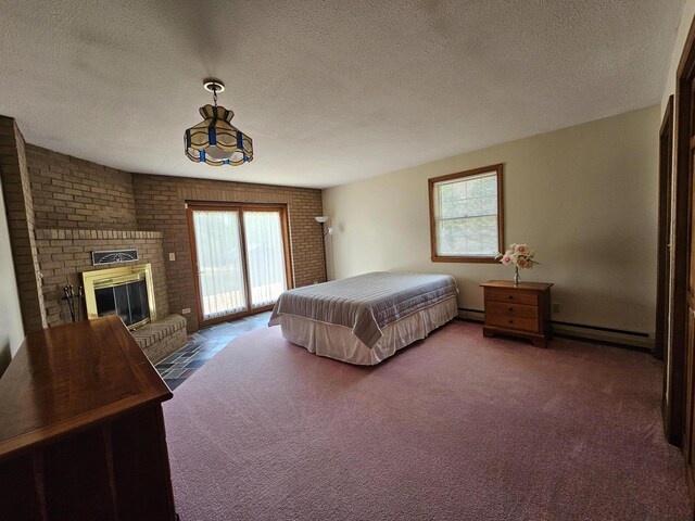 94 Blaisdell Rd, Newport, ME 04953 - bedroom with access to outside, carpet flooring, a baseboard radiator, a brick fireplace, and a textured ceiling
