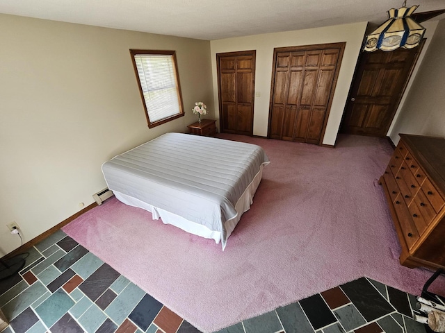 94 Blaisdell Rd, Newport, ME 04953 - bedroom featuring carpet floors, multiple closets, and a baseboard heating unit