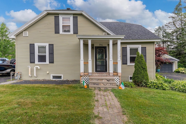 736 Webster St, Lewiston, ME 04240 - bungalow-style house featuring a front lawn and roof with shingles