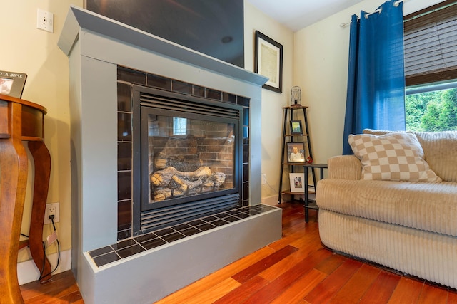 736 Webster St, Lewiston, ME 04240 - detailed view of wood finished floors and a tile fireplace