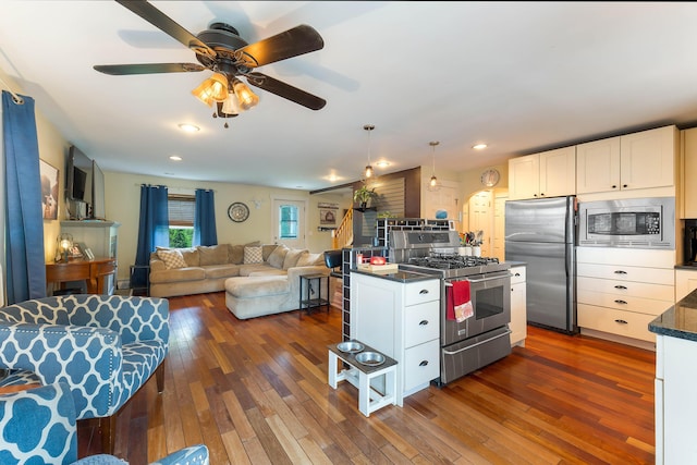 736 Webster St, Lewiston, ME 04240 - kitchen with appliances with stainless steel finishes, dark wood finished floors, white cabinets, and recessed lighting