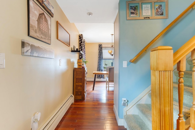 736 Webster St, Lewiston, ME 04240 - hall with stairs, a baseboard heating unit, and dark wood finished floors