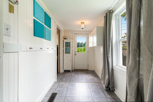 736 Webster St, Lewiston, ME 04240 - doorway to outside featuring healthy amount of natural light