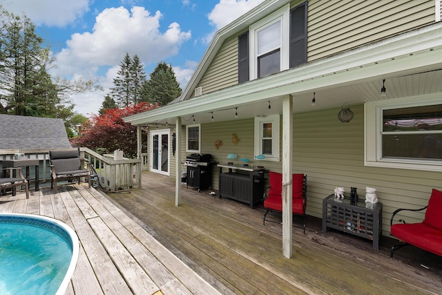 736 Webster St, Lewiston, ME 04240 - wooden deck with a grill and an outdoor pool
