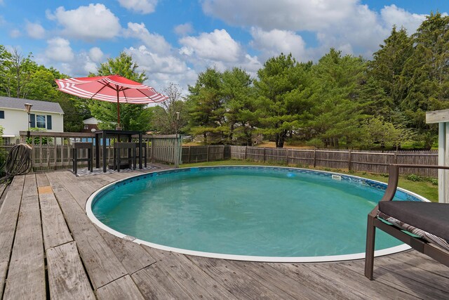 736 Webster St, Lewiston, ME 04240 - view of pool with a wooden deck and a fenced backyard