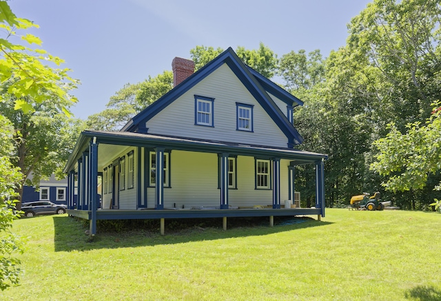 239 Ocean Point Rd, Boothbay, ME 04544 - back of property featuring a chimney, a porch, and a yard