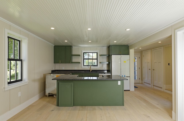 239 Ocean Point Rd, Boothbay, ME 04544 - kitchen with green cabinets, freestanding refrigerator, open shelves, crown molding, and recessed lighting