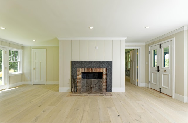 239 Ocean Point Rd, Boothbay, ME 04544 - unfurnished living room featuring crown molding, light wood-type flooring, a fireplace, and recessed lighting