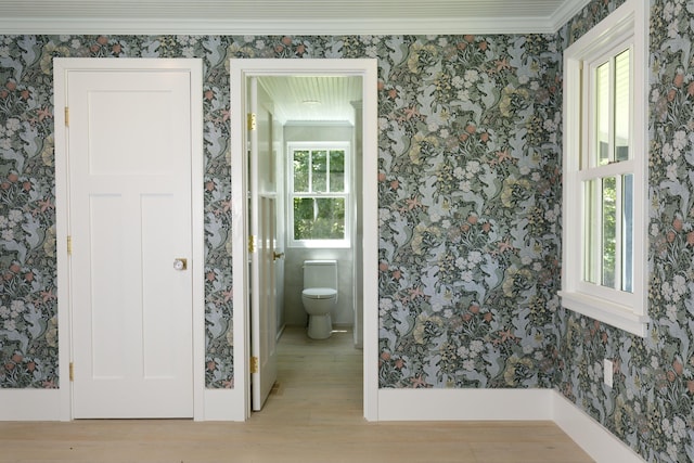 239 Ocean Point Rd, Boothbay, ME 04544 - bathroom with wallpapered walls and wood finished floors