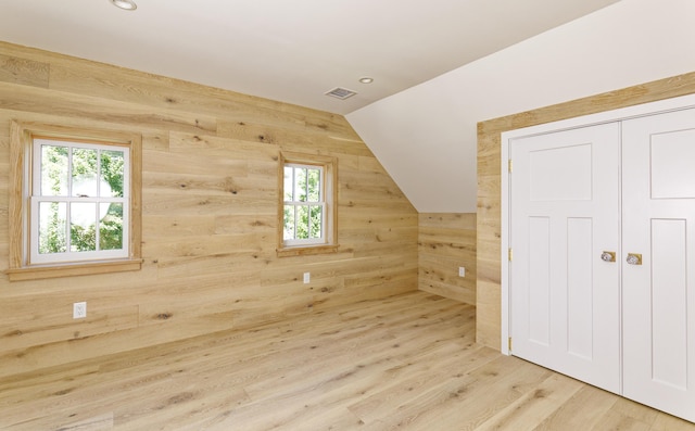 239 Ocean Point Rd, Boothbay, ME 04544 - additional living space with plenty of natural light, wood walls, vaulted ceiling, wood finished floors, and recessed lighting