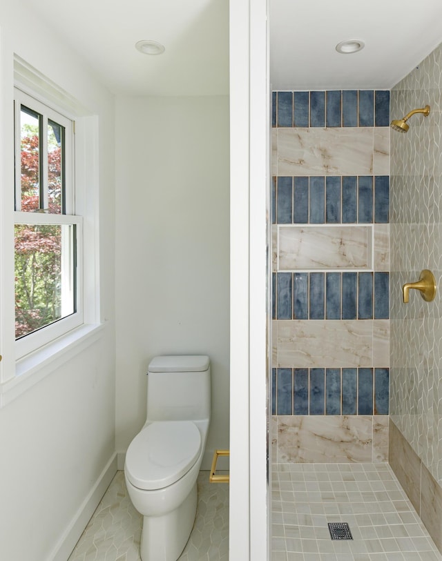239 Ocean Point Rd, Boothbay, ME 04544 - bathroom featuring a tile shower and toilet