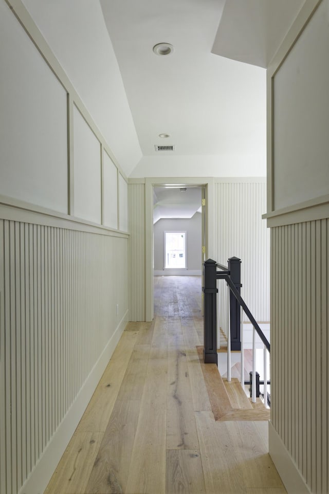 239 Ocean Point Rd, Boothbay, ME 04544 - hall featuring light wood-style floors and a decorative wall