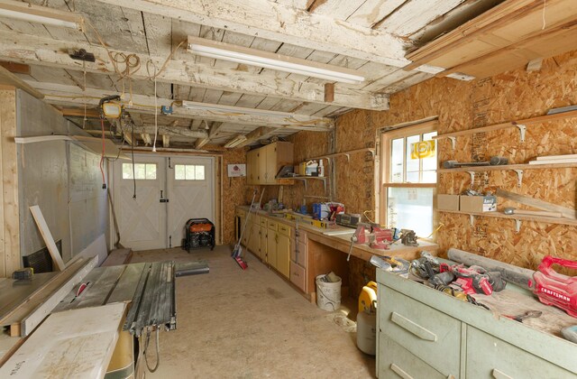 239 Ocean Point Rd, Boothbay, ME 04544 - miscellaneous room featuring healthy amount of natural light and a workshop area