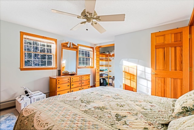 36 Worcester Way, Lincoln, ME 04457 - carpeted bedroom featuring ceiling fan and a baseboard radiator