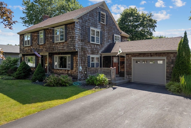 36 Woodlawn Ave, Auburn, ME 04210 - shingle-style home featuring a garage, a chimney, a front lawn, roof with shingles, and asphalt driveway