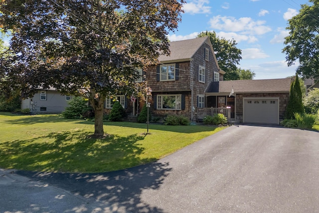36 Woodlawn Ave, Auburn, ME 04210 - shingle-style home with a garage, asphalt driveway, a front lawn, and a shingled roof