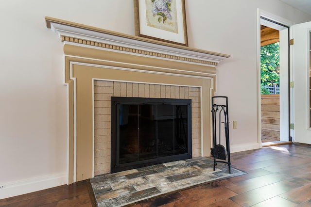 36 Woodlawn Ave, Auburn, ME 04210 - detailed view of a brick fireplace and wood finished floors