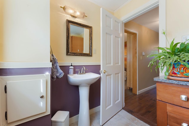 36 Woodlawn Ave, Auburn, ME 04210 - bathroom with wood finished floors and ornamental molding