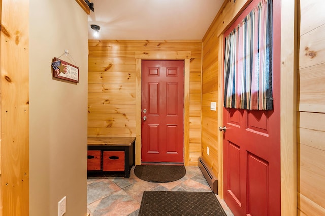 36 Woodlawn Ave, Auburn, ME 04210 - foyer entrance featuring baseboard heating, stone finish floors, and wood walls