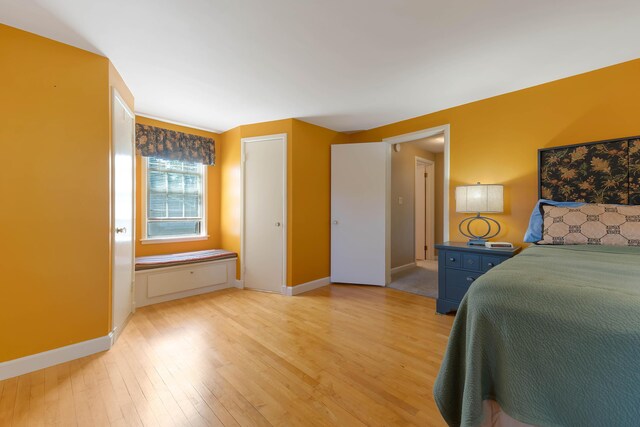 36 Woodlawn Ave, Auburn, ME 04210 - bedroom with light wood-type flooring and baseboards