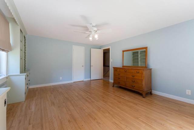 36 Woodlawn Ave, Auburn, ME 04210 - unfurnished bedroom featuring light wood-type flooring, ceiling fan, and a closet