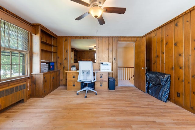 36 Woodlawn Ave, Auburn, ME 04210 - office with radiator heating unit, a ceiling fan, light wood-style floors, and wooden walls