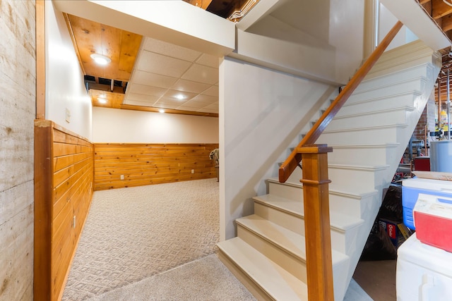 36 Woodlawn Ave, Auburn, ME 04210 - staircase featuring carpet flooring, a wainscoted wall, and wood walls