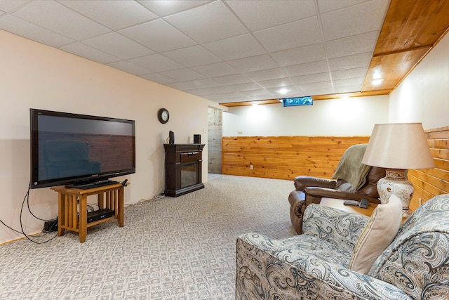 36 Woodlawn Ave, Auburn, ME 04210 - carpeted living room featuring wooden walls, wainscoting, a paneled ceiling, and a fireplace